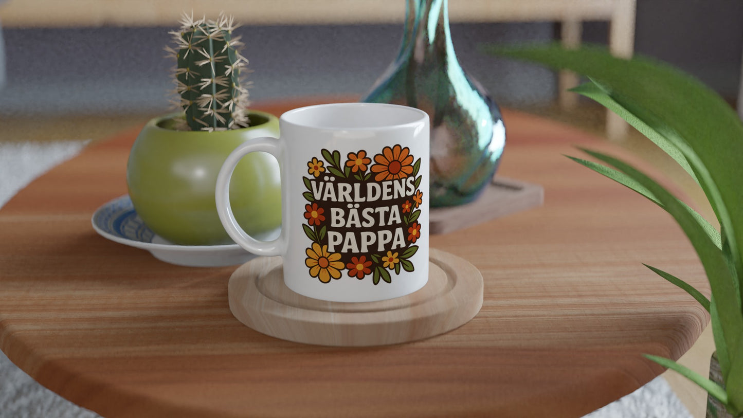 Mugg med 'Världens bästa pappa' inramat av blommor, perfekt för pappans fika. Stilfull och speciell!