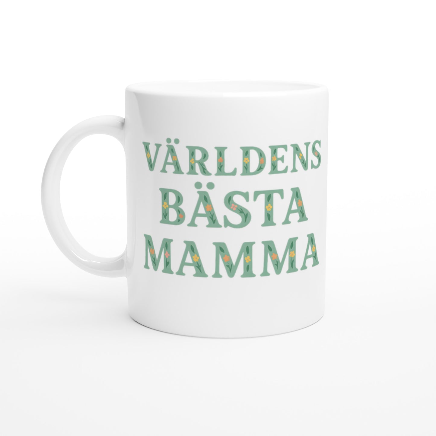 Mugg med blommigt mönster och texten 'Världens bästa mamma' i mjuk grön färg. Perfekt present till mamma.