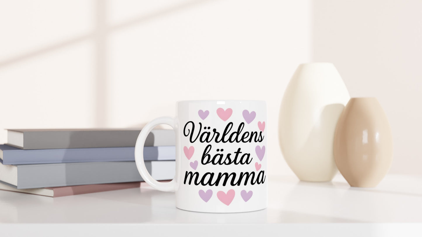 Mugg med hjärtan och texten 'Världens bästa mamma'. Perfekt för kaffe och te.
