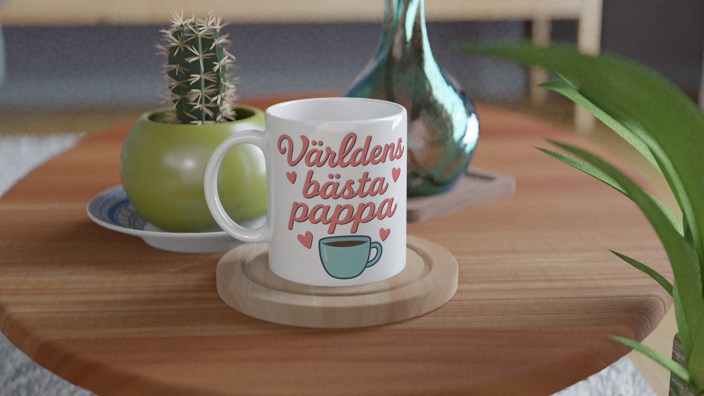 Mugg med texten 'Världens bästa pappa' i mjuka bokstäver. Perfekt present till fars dag!