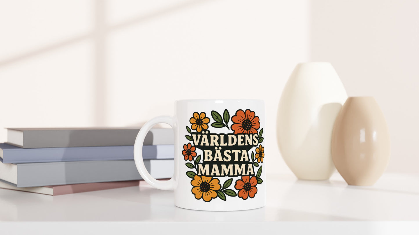 Mugg med blommor i varma toner och kärleksfull text för att fira världens bästa mamma. Blommande Mammas Kärlek.