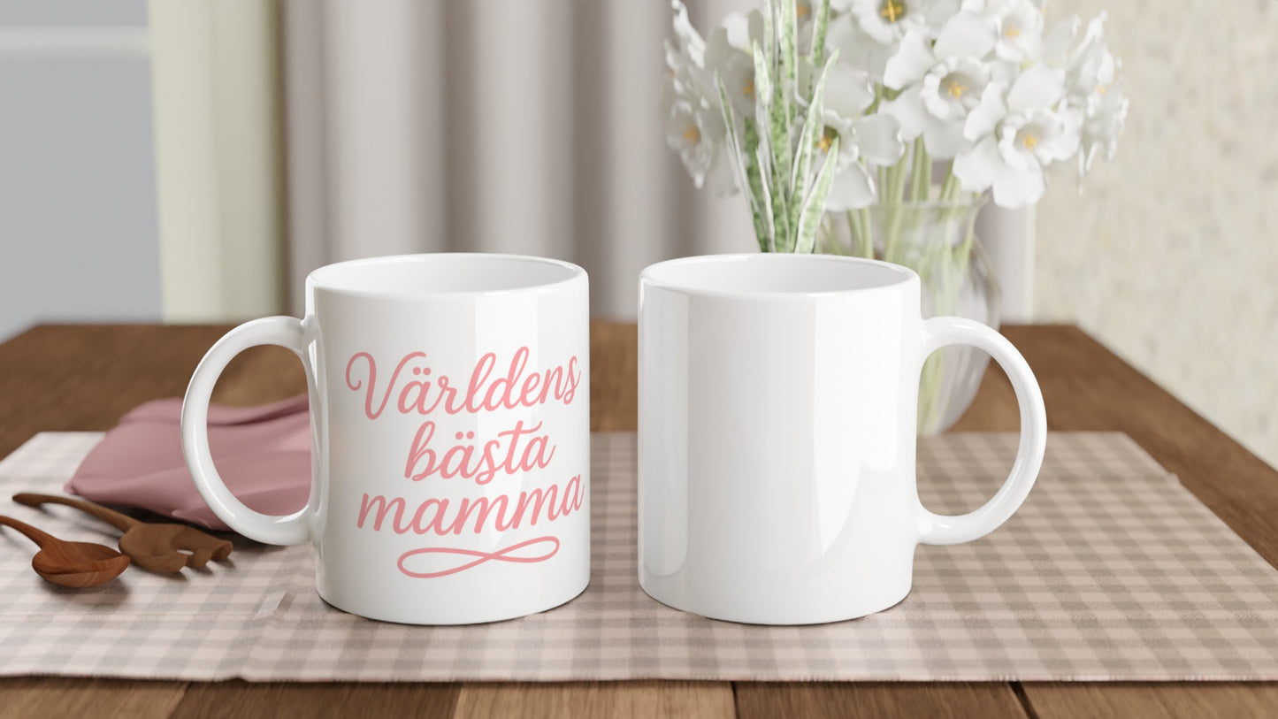 Mugg med texten 'Världens bästa mamma' i elegant handskriven font och varm rosa färg.