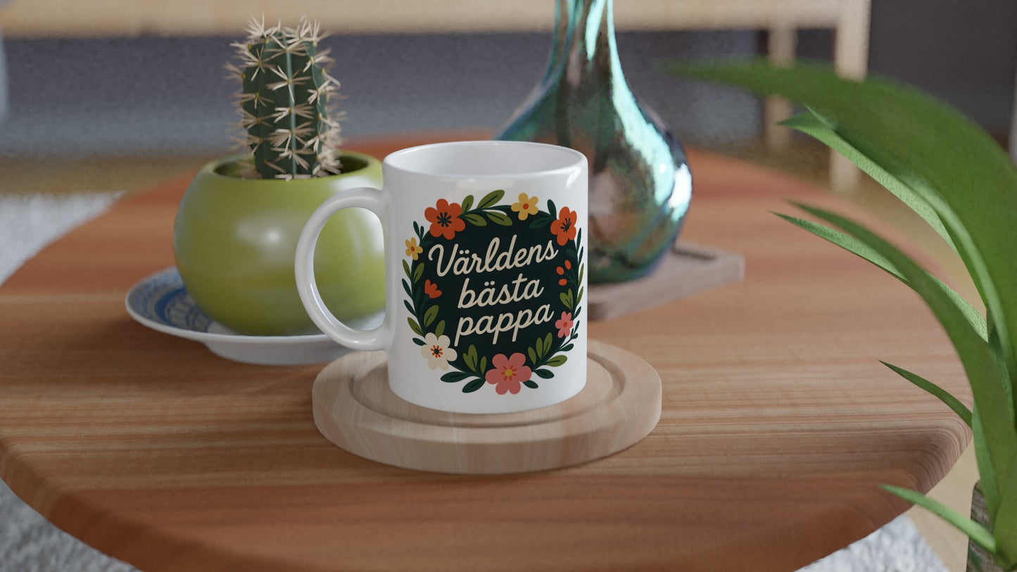 Mugg med blomkrans och text 'Världens bästa pappa'. Elegant och stilfull med handskriven komposition. Perfekt för fars dag!