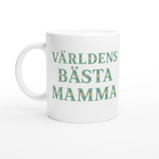 Mugg med blommigt mönster och texten 'Världens bästa mamma' i mjuk grön färg. Perfekt present till mamma.