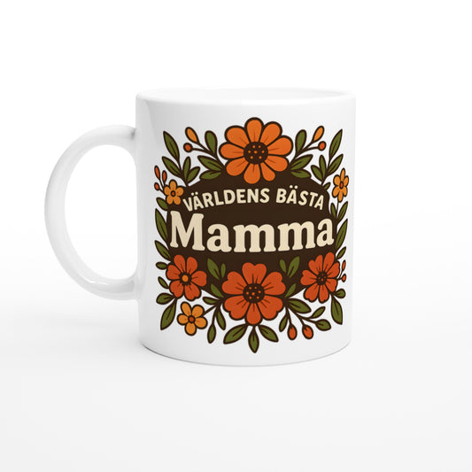 Mugg med blomstrande mönster och texten 'Världens bästa mamma' i fokus, omgiven av varma blommor. För att hedra mamman.