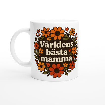 Mugg med texten 'Världens bästa mamma' omgiven av varma blommor. Perfekt gåva till mamma.