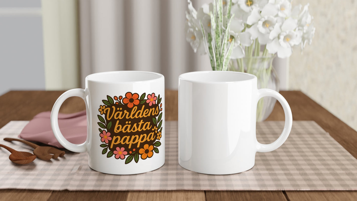 Mugg med texten 'Världens bästa pappa' och blomstermönster, perfekt för morgonkaffet.