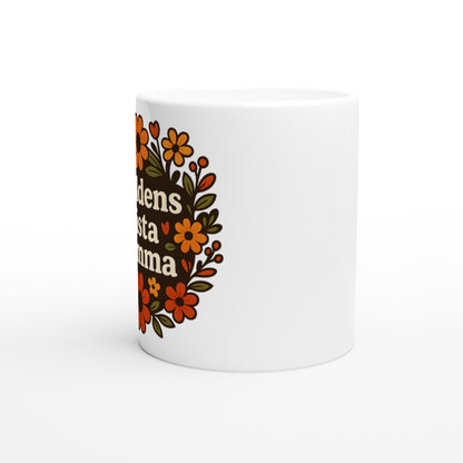 Mugg med texten 'Världens bästa mamma' omgiven av varma blommor. Perfekt gåva till mamma.