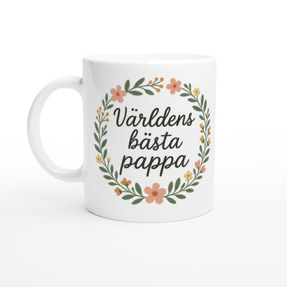 Stilfull mugg med texten 'Världens bästa pappa' omgiven av blomkrans i handskriven stil.