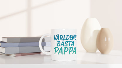 Mugg med handskriven text i grönt och blått, perfekt present för världens bästa pappa.