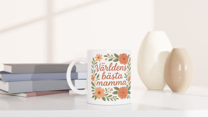 Mugg med texten 'Världens bästa mamma' i blomsterdesign. Överraska mamma och visa din kärlek varje dag. Perfekt present!
