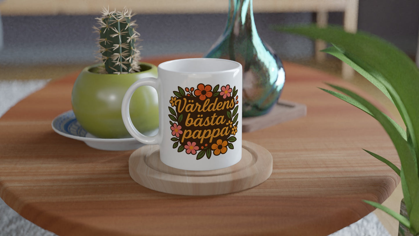 Mugg med texten 'Världens bästa pappa' och blomstermönster, perfekt för morgonkaffet.