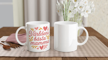 Mugg med texten 'Världens bästa mamma' i romantisk stil, dekorerad med hjärtan och former.