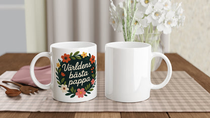 Mugg med blomkrans och text 'Världens bästa pappa'. Elegant och stilfull med handskriven komposition. Perfekt för fars dag!